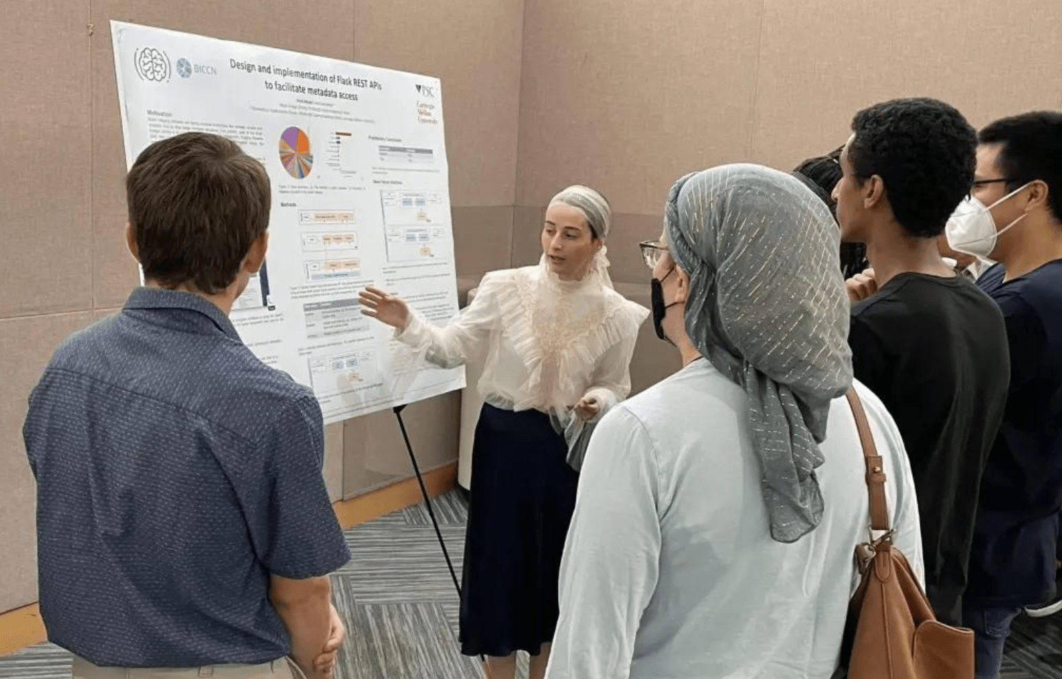 A PSC intern presenting a poster. 