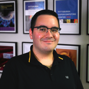 A portrait photo of a person with light skin tone, brown hair and glasses.